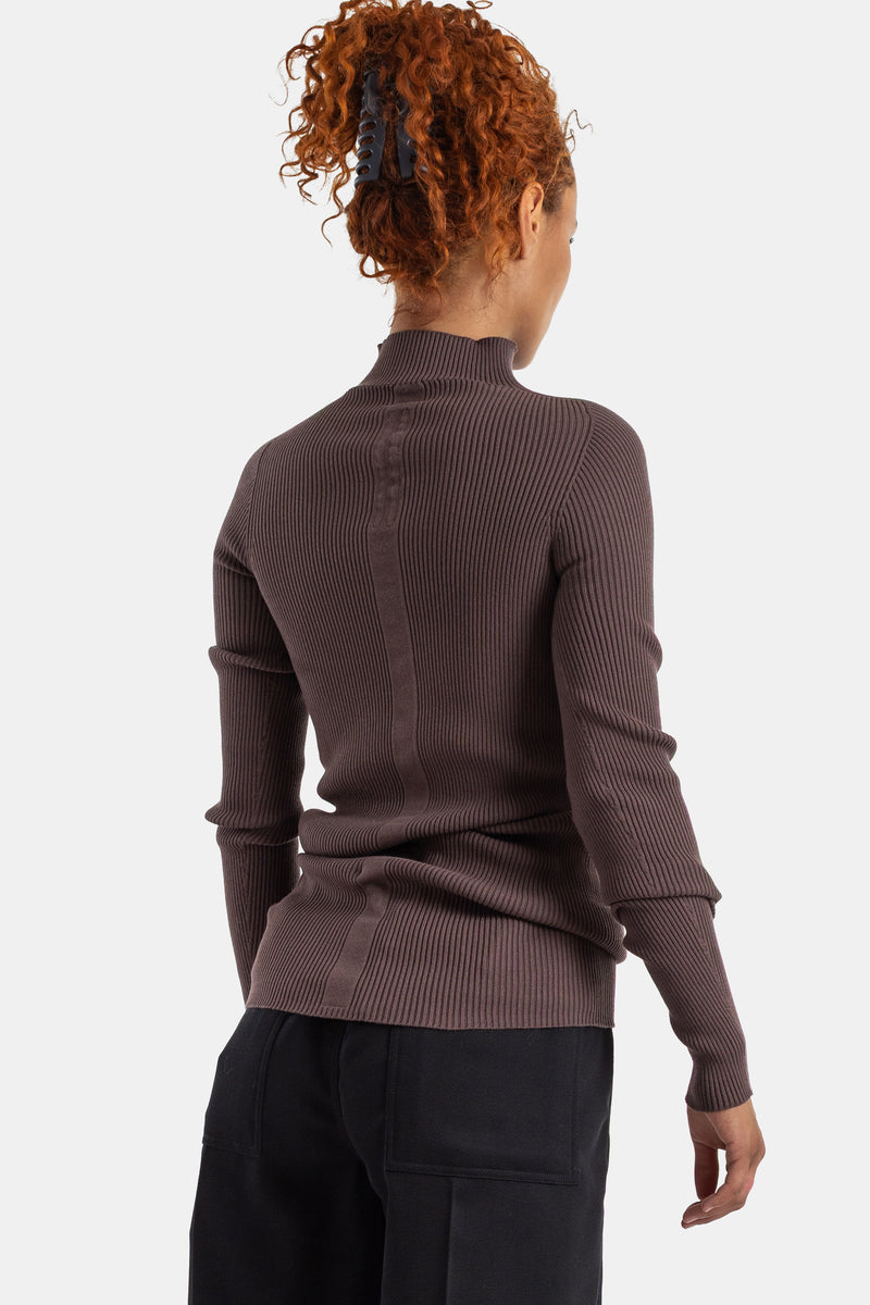Detailed rear view of a Rick Owens women's ribbed knit high neck brown sweater with tied-up red hair.