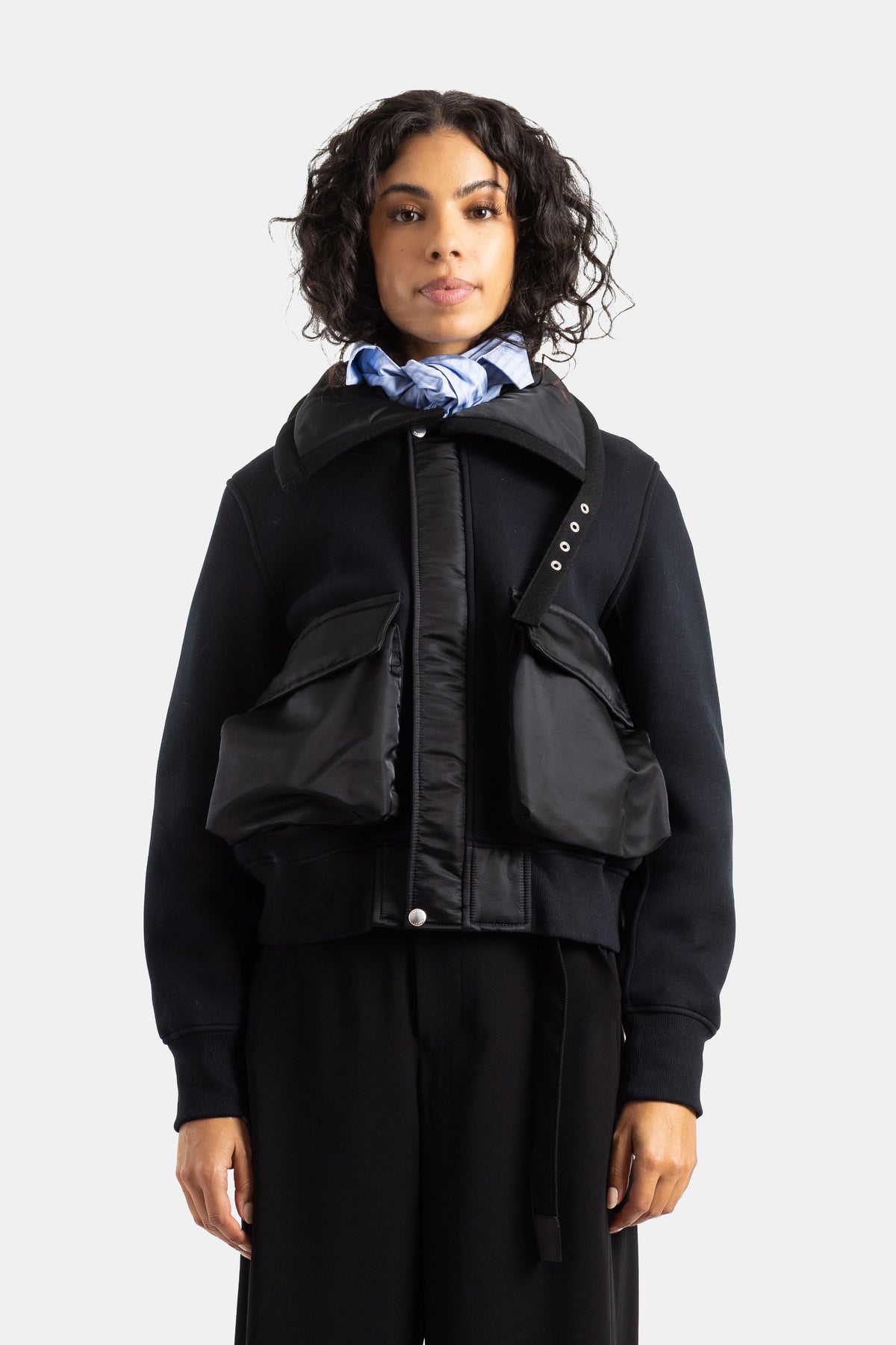 Sacai black bi-material neoprene sweat jacket and oversized nylon cargo vest for women with a shawl collar