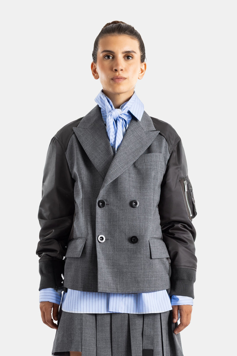 Sacai veste hybride croisée lainage gris et manches bomber nylon noir coupe courte femme