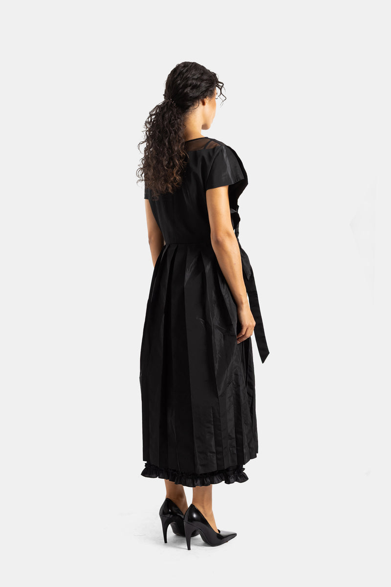 Simone Rocha black backless dress in crinkled taffeta with tied ribbon detail and gathered ruffle hem