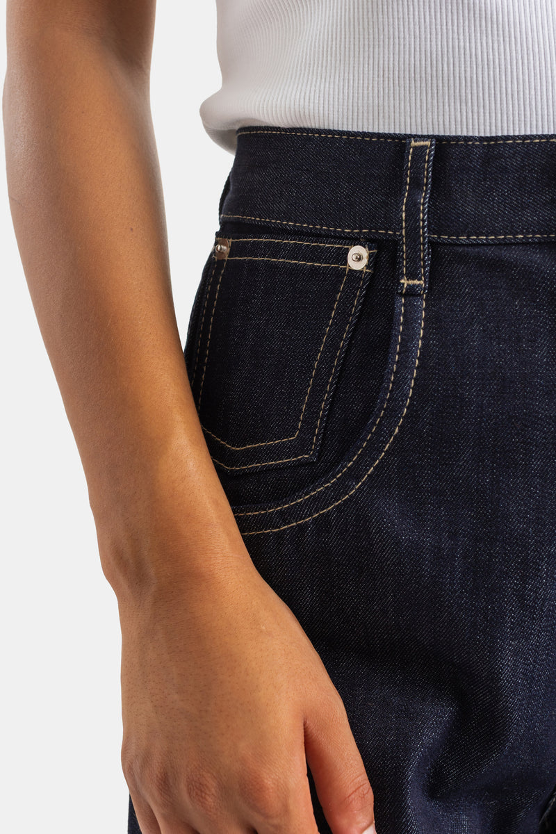 Sofie d'Hoore women's high-waisted raw denim jeans, front pocket detail with silver rivets and contrast seams