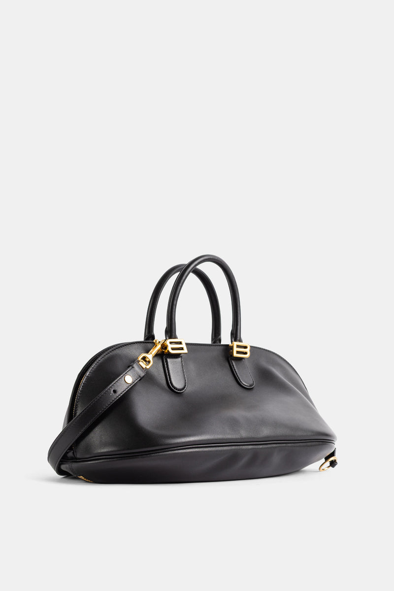Balenciaga Bolero Bowling vue trois quarts, cuir lisse noir souple et bandoulière ajustable dorée