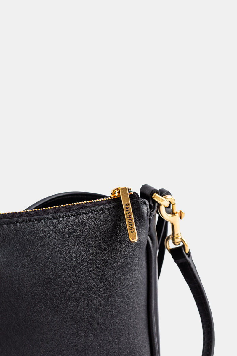 Pochette Rodeo Sling cuir lisse naturel noir