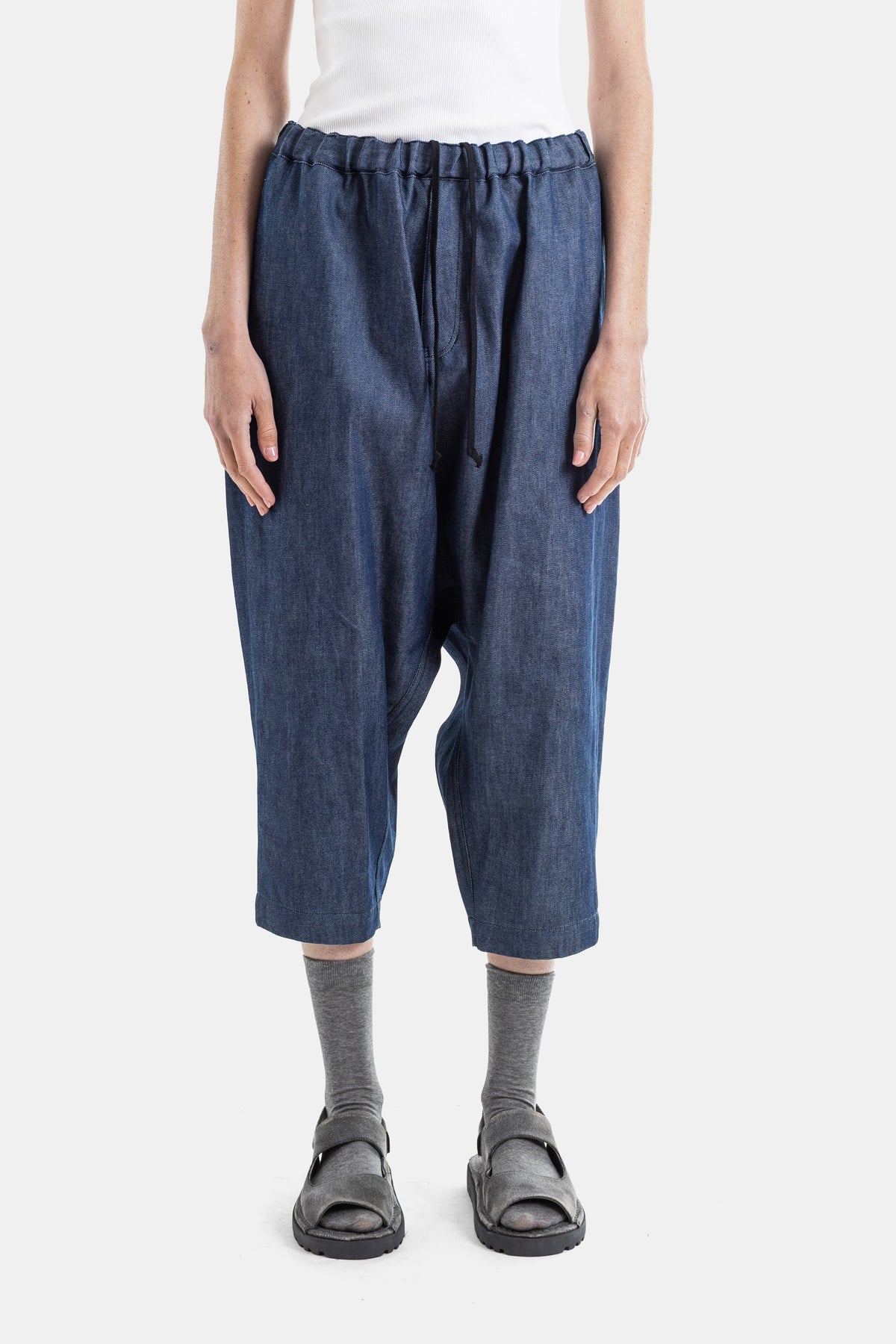 Comme des Garçons wide harem trousers in indigo blue denim, drop crotch cut, elasticated waist, SS26 women's