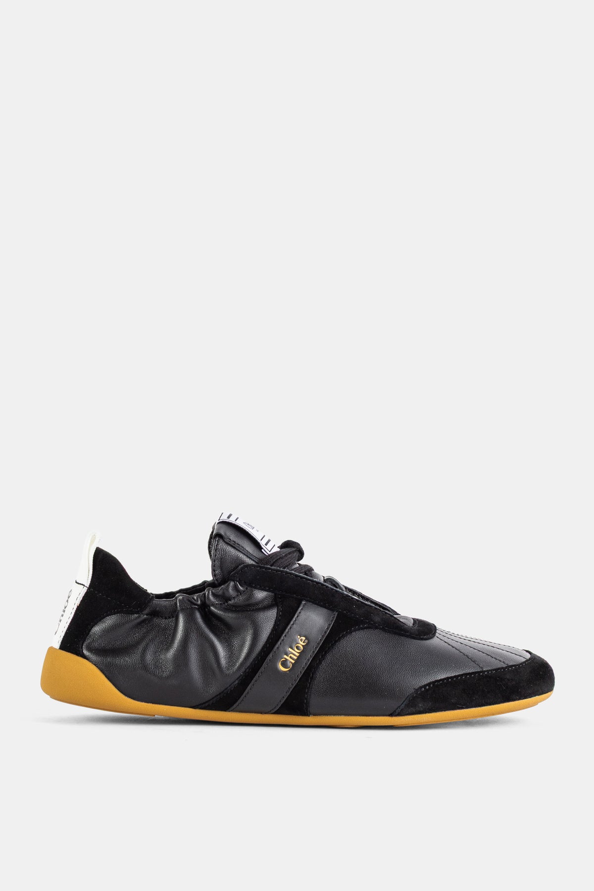 Sneaker plate en agneau et daim Kick noir semelle gomme
