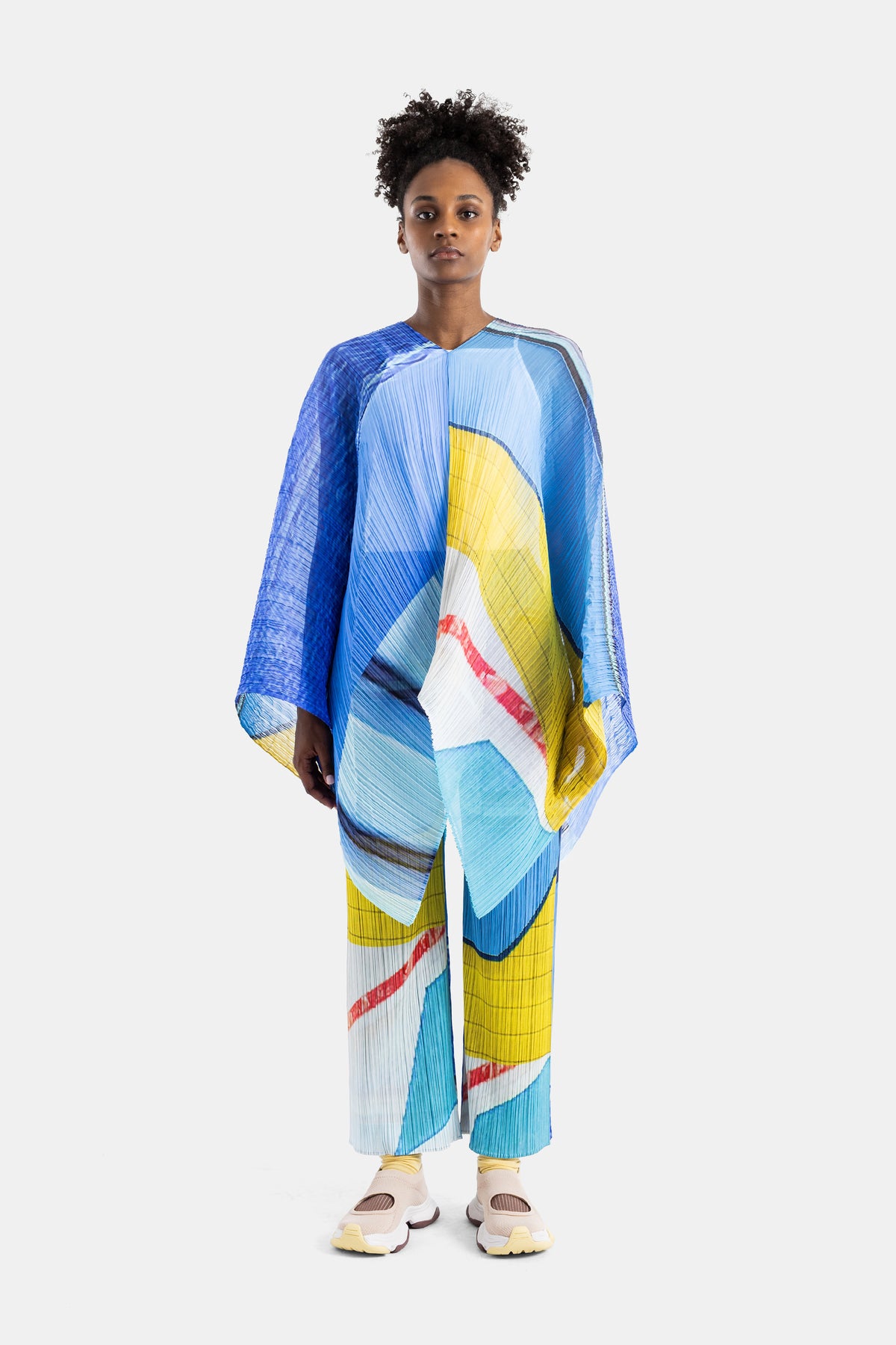 Pleats Please Issey Miyake stole poncho pleated blue yellow graphic collage print loose oversized silhouette women SS26