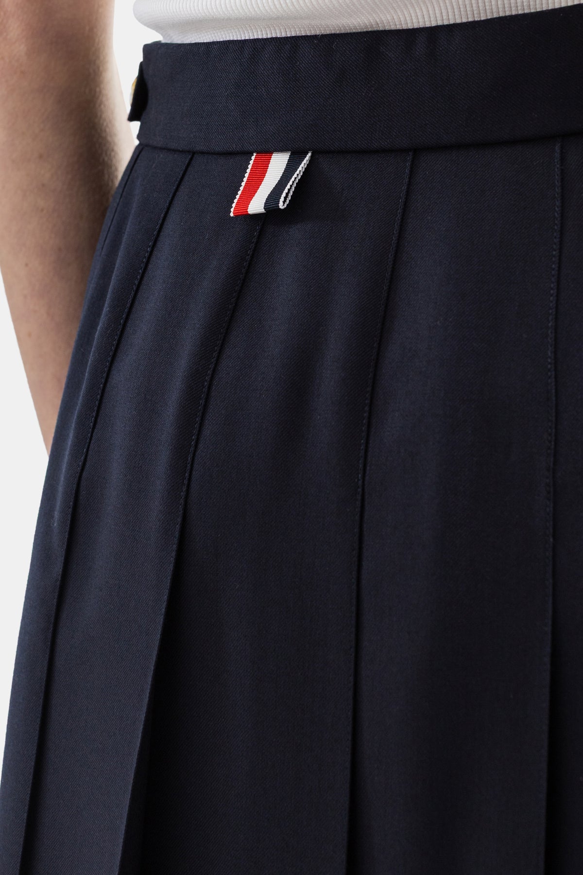 Jupe longue plissée en twill de laine marine