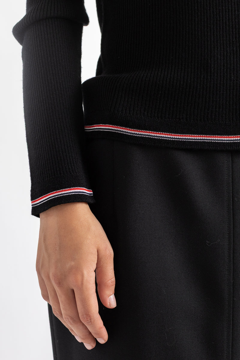 Thom Browne cardigan mérinos noir zoom poignet liseré tricolore RWB rouge blanc détail finition côtelée